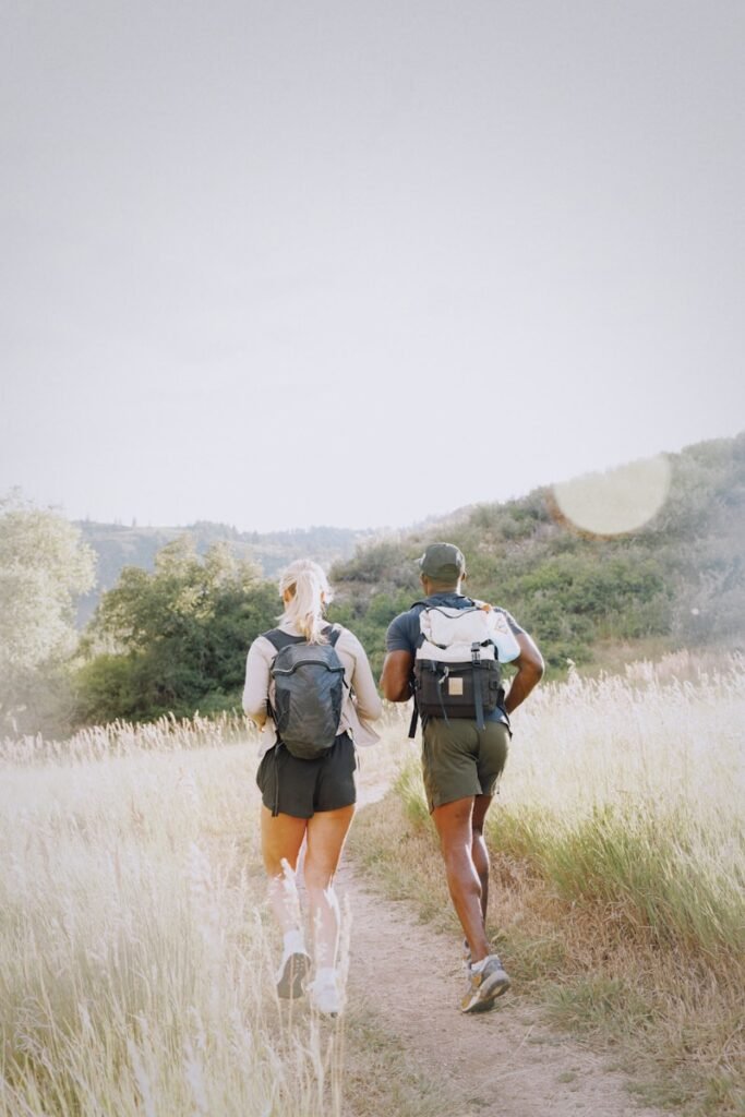 Couple hiking on a sunny trail