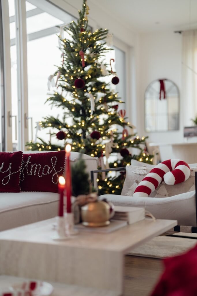 Cozy living room decorated for christmas with a tree.